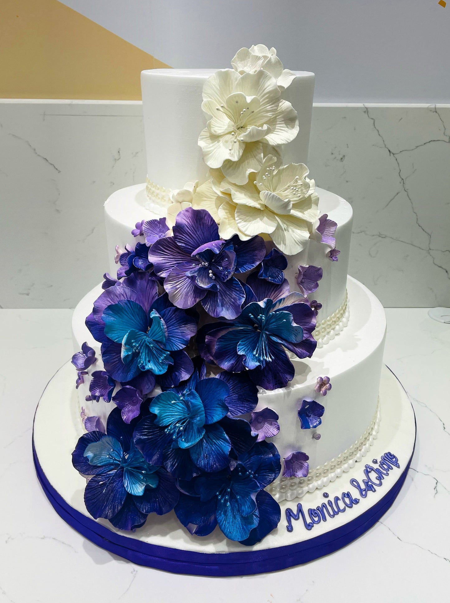 Purple & Blue Cascading Flowers Wedding Cake